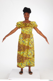 Dina Moses A poses dressed standing whole body yellow long…